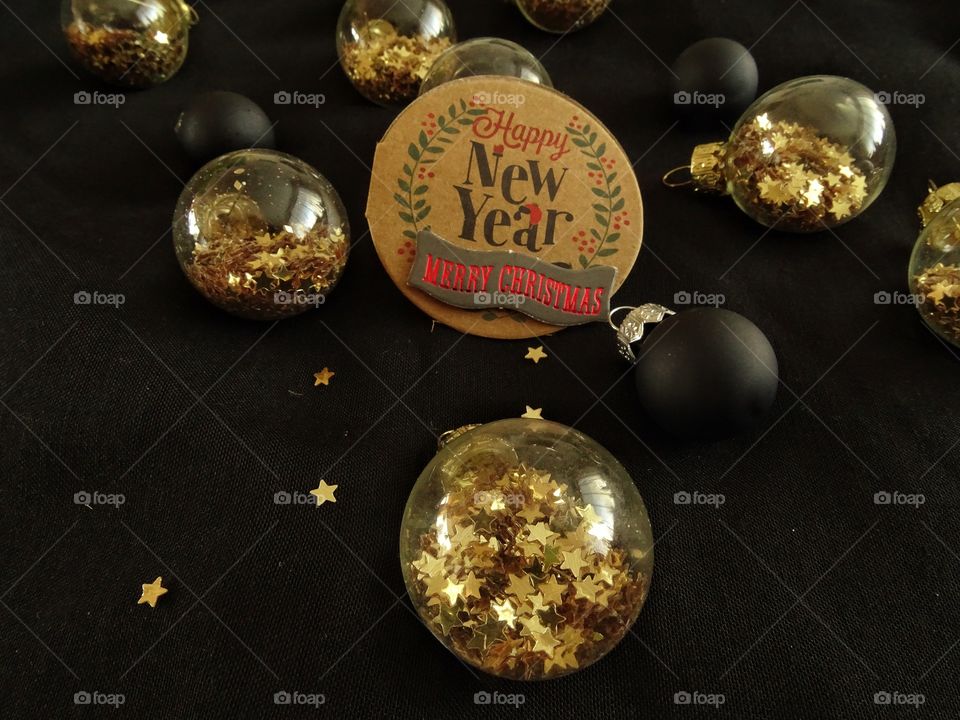 Christmas ball with golden stars and tag