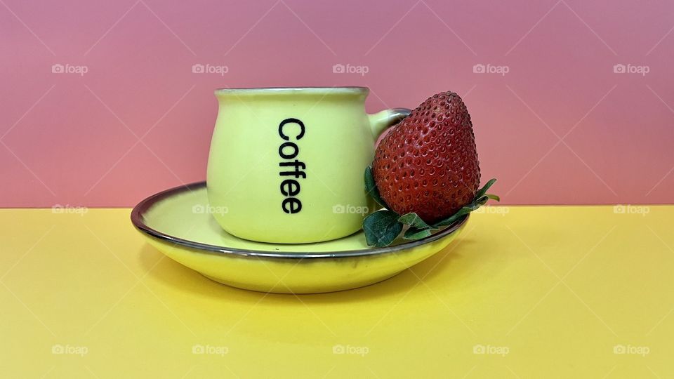 Yellow Coffee cup and saucer with strawberry 