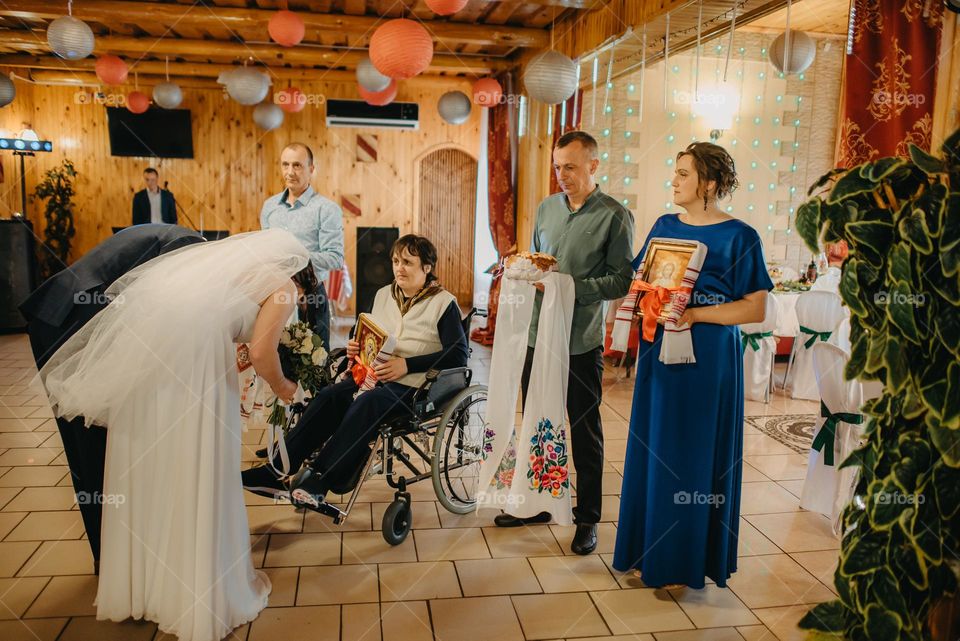Blessing of the bride and groom with icons in Wedding