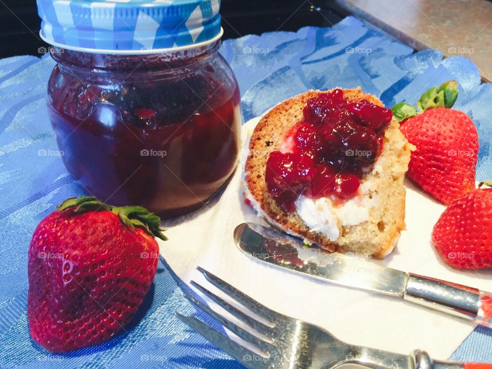 Delicious jam on bread with strawberry and napkin