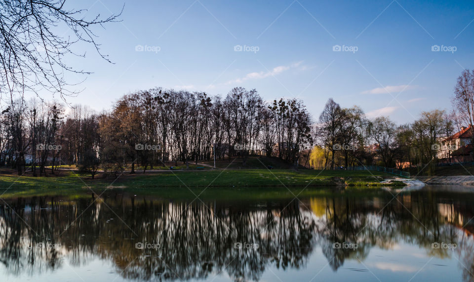 city park with lake in the spring season