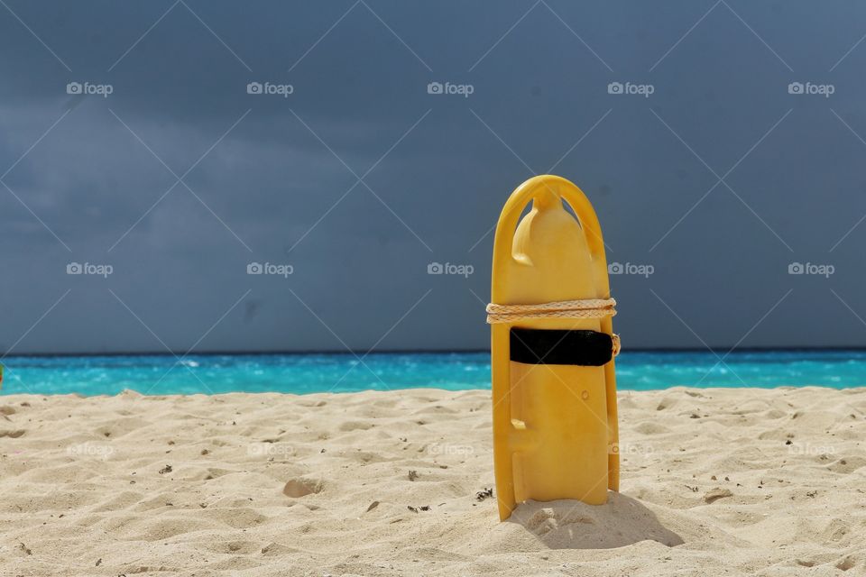 yellow lifebelt at caribbean beach