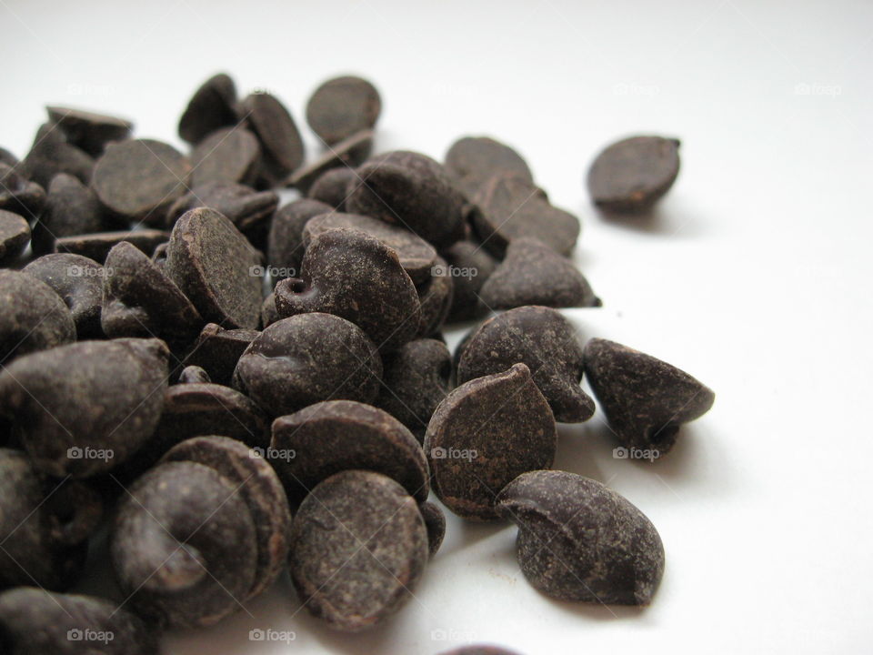 Chocolate chips on white background