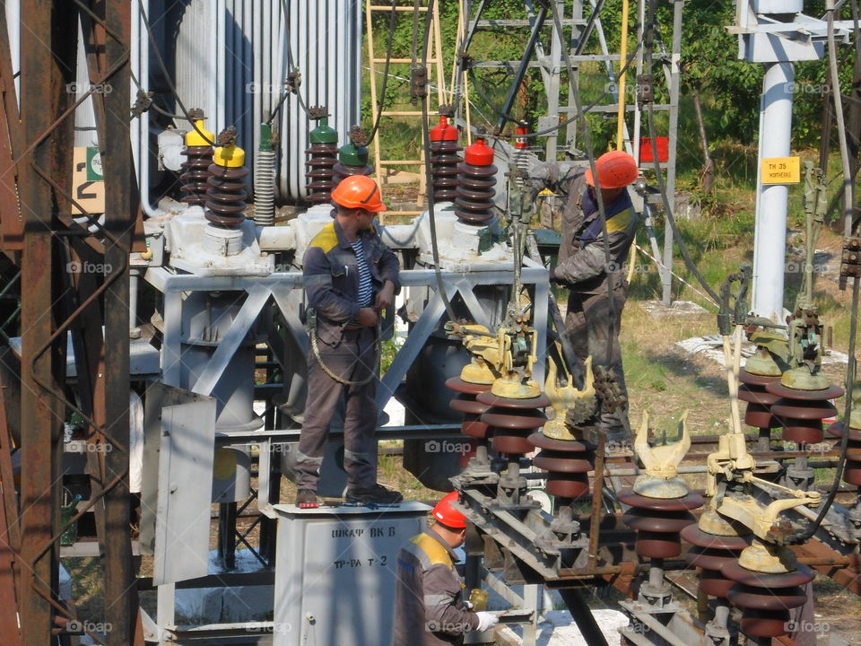 Brigade electricians repairing electrical equipment