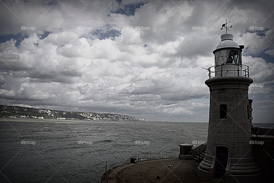 clouds sea lighthouse harbour by leonbritton123