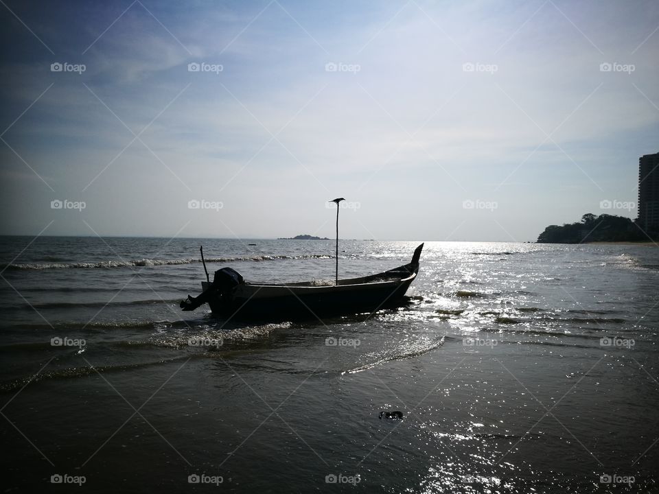 Fisherman boat at low tide
