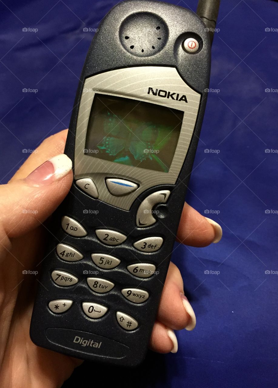 Holding an old Nokia