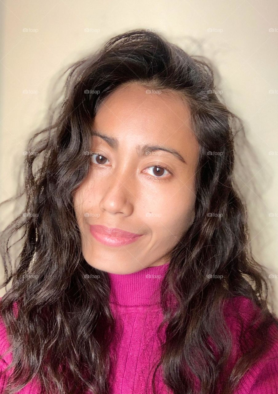 A woman’s selfie in a portrait mode.