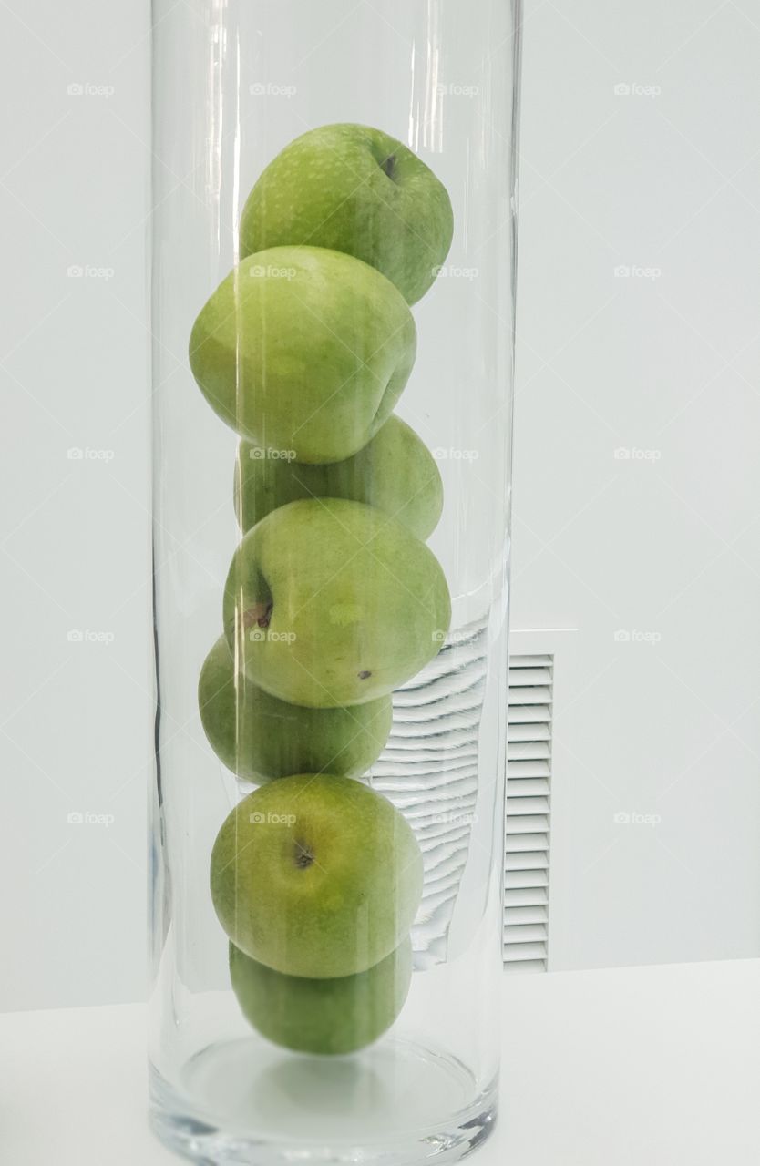 Apple in a glass tube