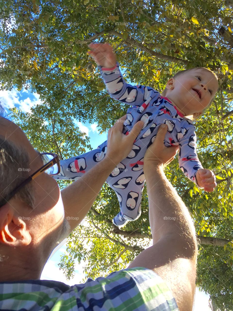 Father with baby daughter in the park 