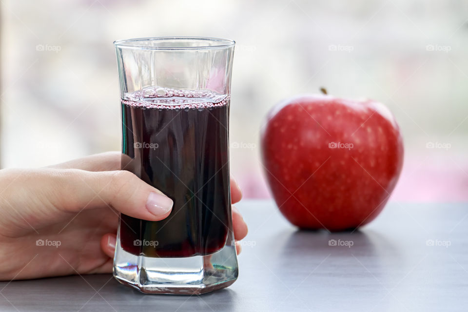 Woman holding apple juice