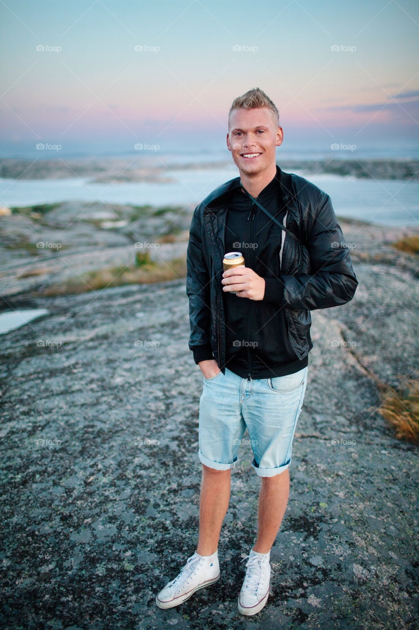 Happy man holding a beer