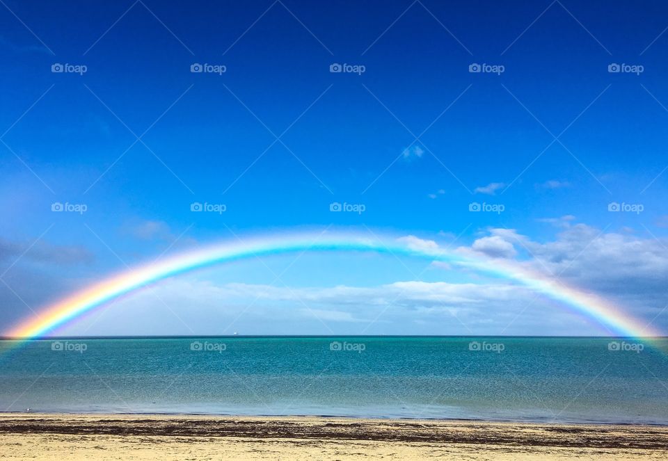 Bright full Rainbow over the ocean, South Australia