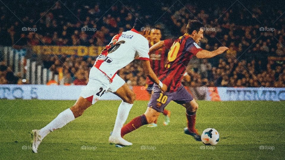 In order to score a goal, players from both teams tried their best to compete for the football.(Soccer Match)