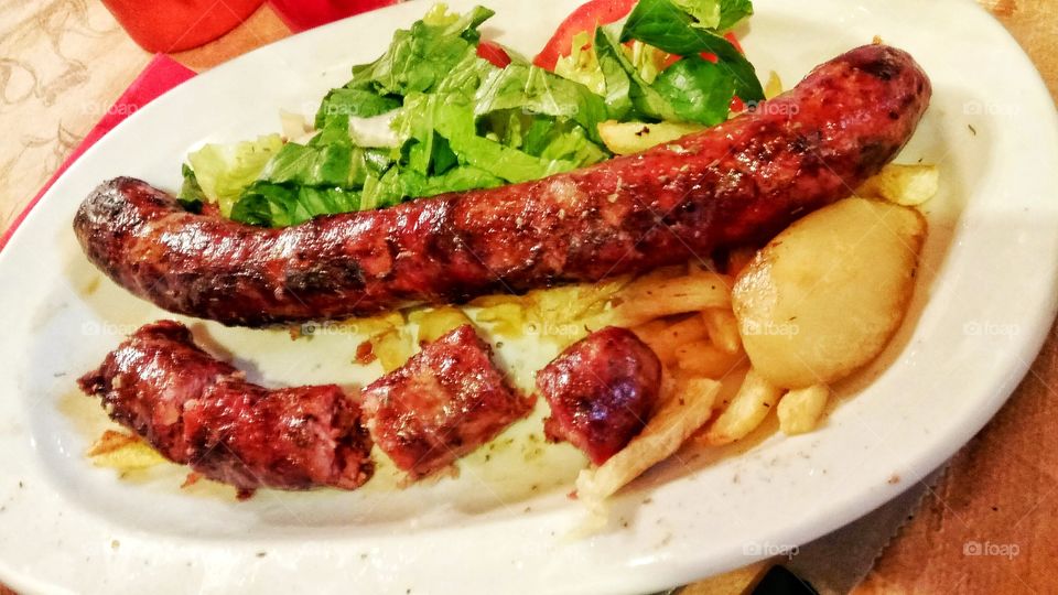 A traditional dish of country lukaniko (sausage) made with wild boar meat,common in Ano Trikala,Greece