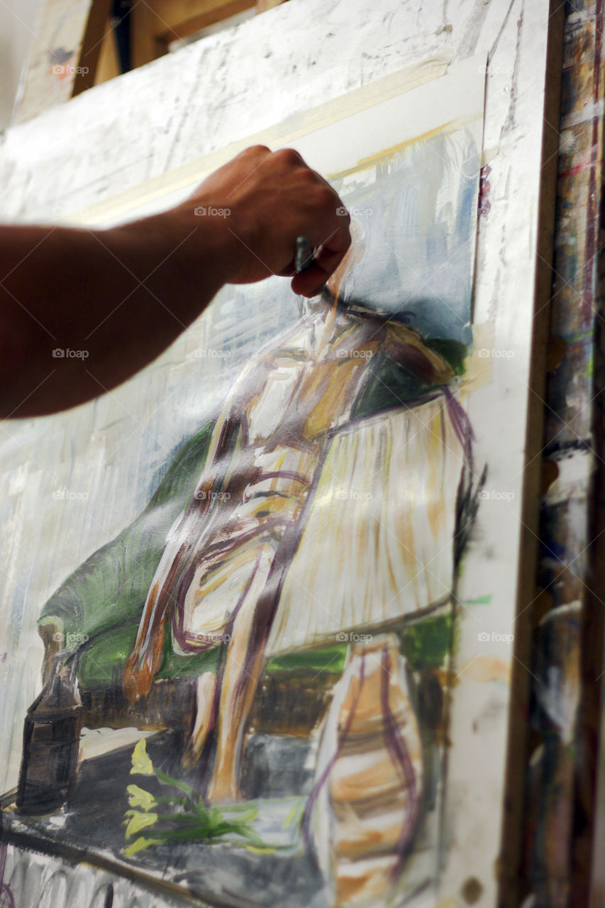 An artist paints in the studio