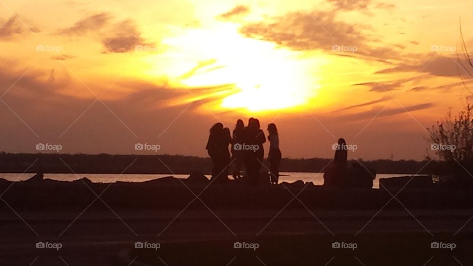 girls enjoying  sunset. girls enjoying sunset 