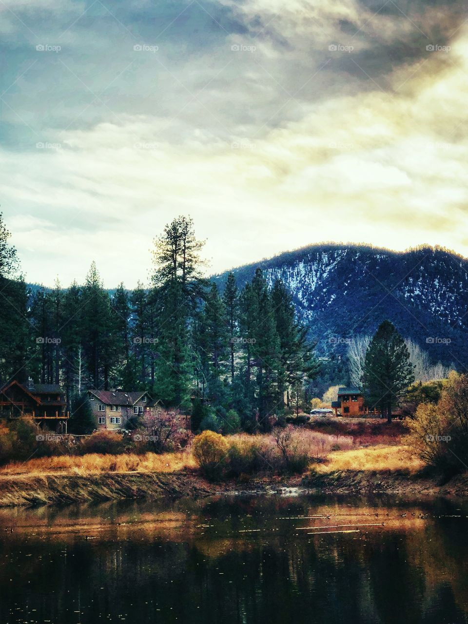 Beautiful golden fall day by the lake this in the mountains