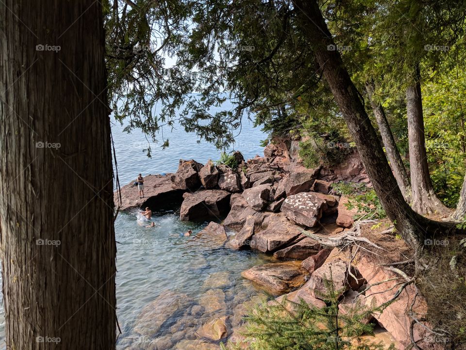 Gazing down at the shoreline of lake Superior from a trail on Madeline island