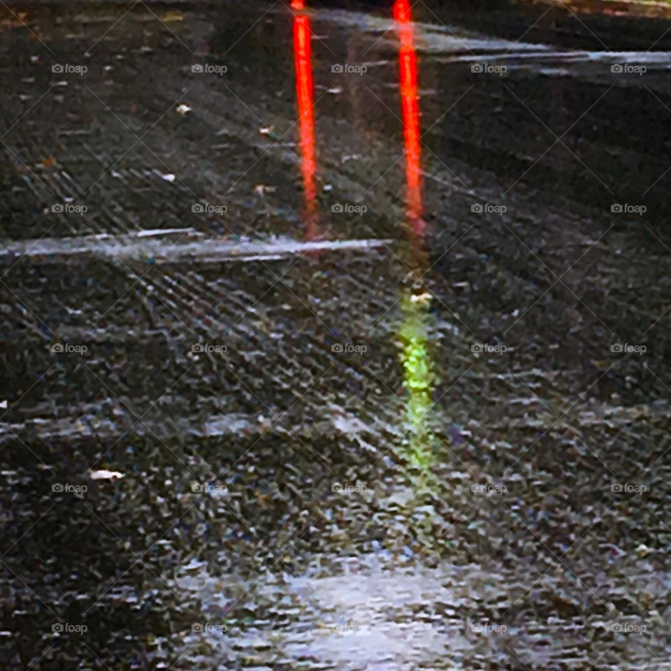 tail lights on a rainy slick road