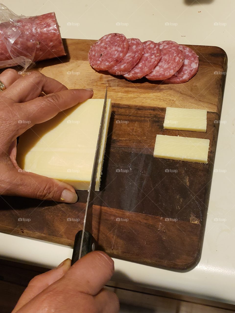 preparing fresh salami and cheese