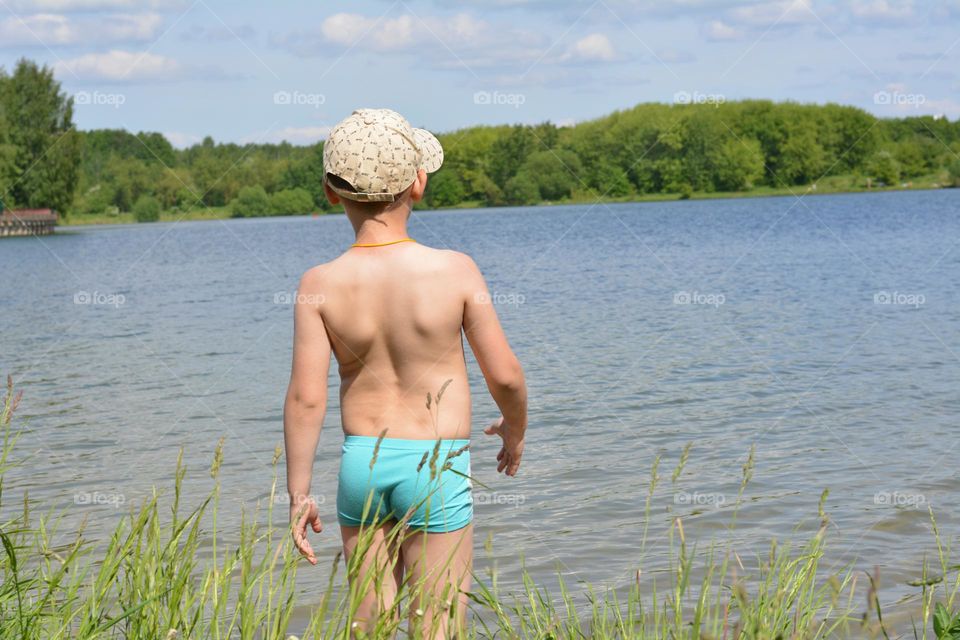 child swimming on a lake summer vacation