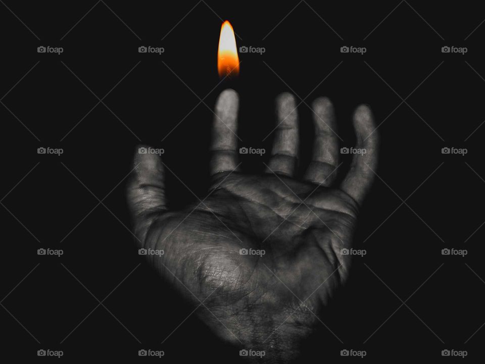 Burning hand in the dark