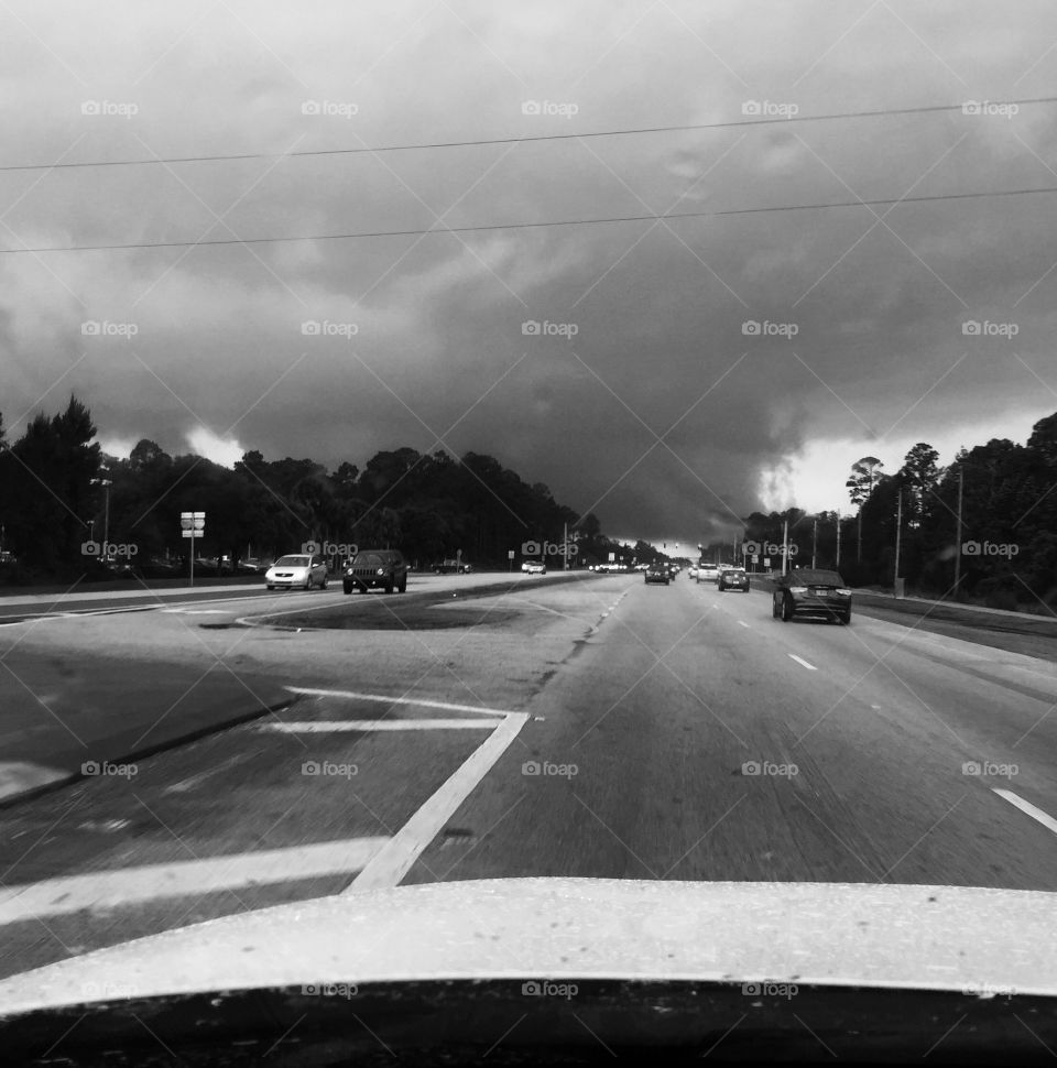 Storm clouds on the horizon on a Florida highway.