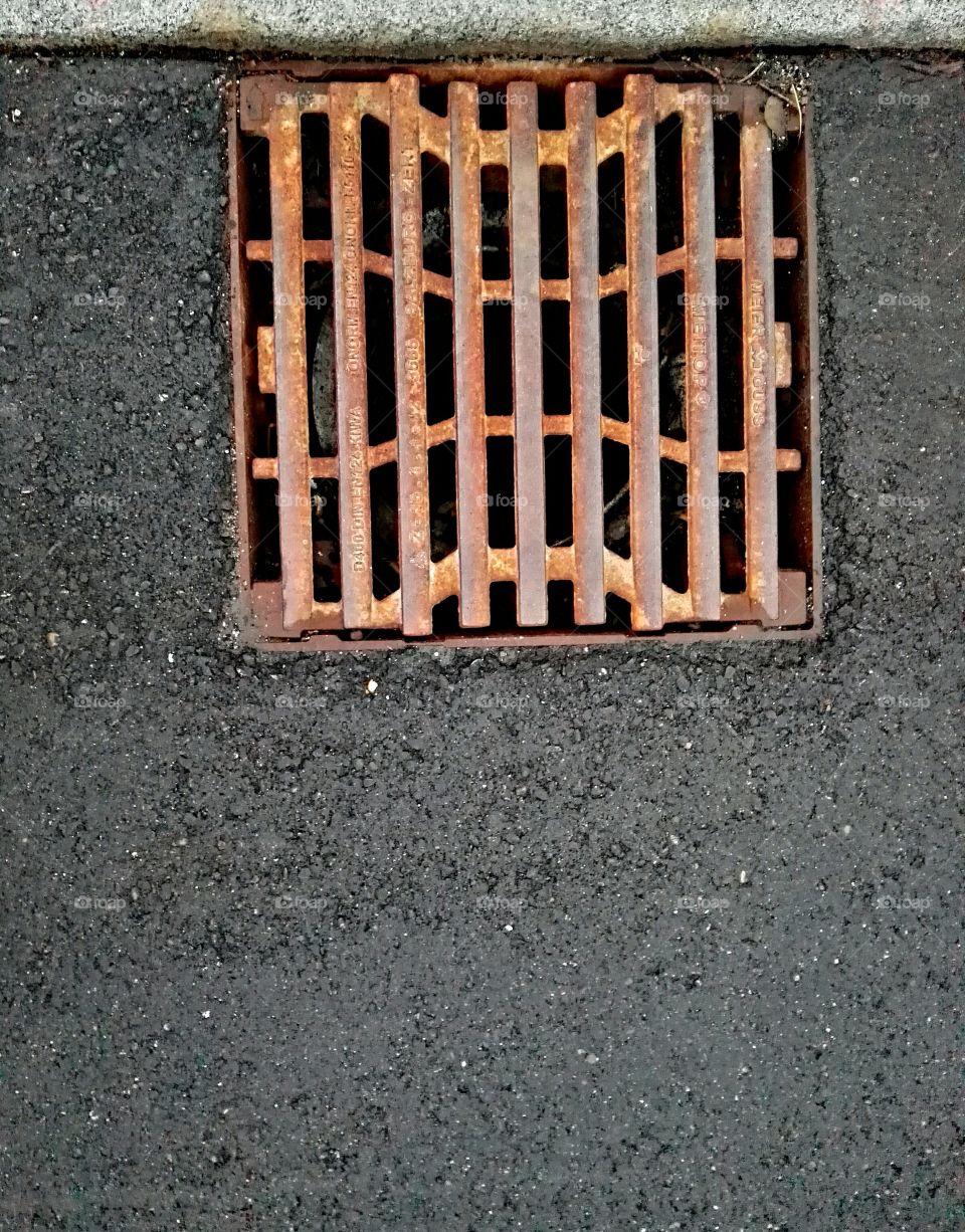 grate in asphalt