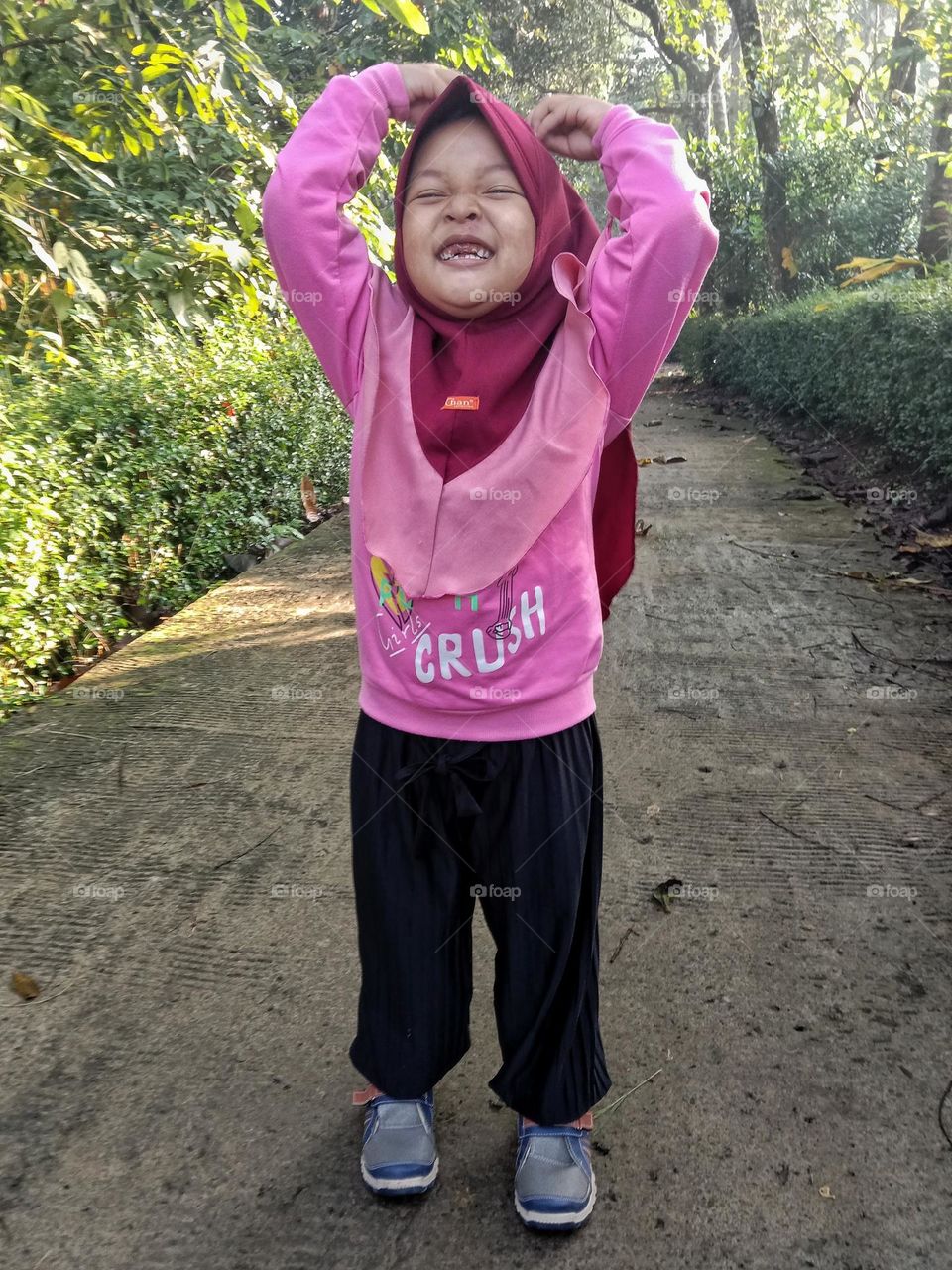 The joy of a little girl when she goes to school for the first time.