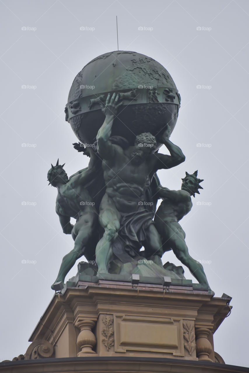 Statue of Hercules carrying the globe on the roof of main railwaystation of Frankfurt