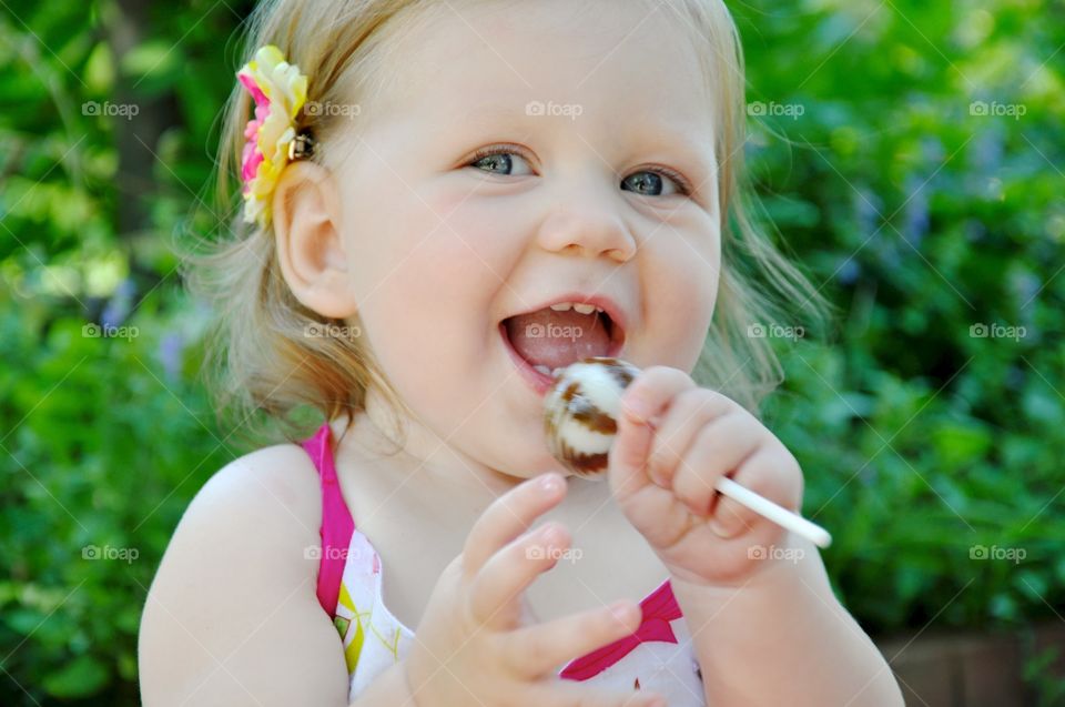 Springtime Smiles. While enjoying a lollipop