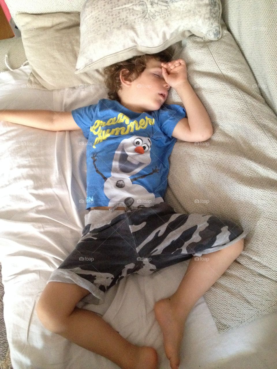 Rest from the play. Child sleeping after play