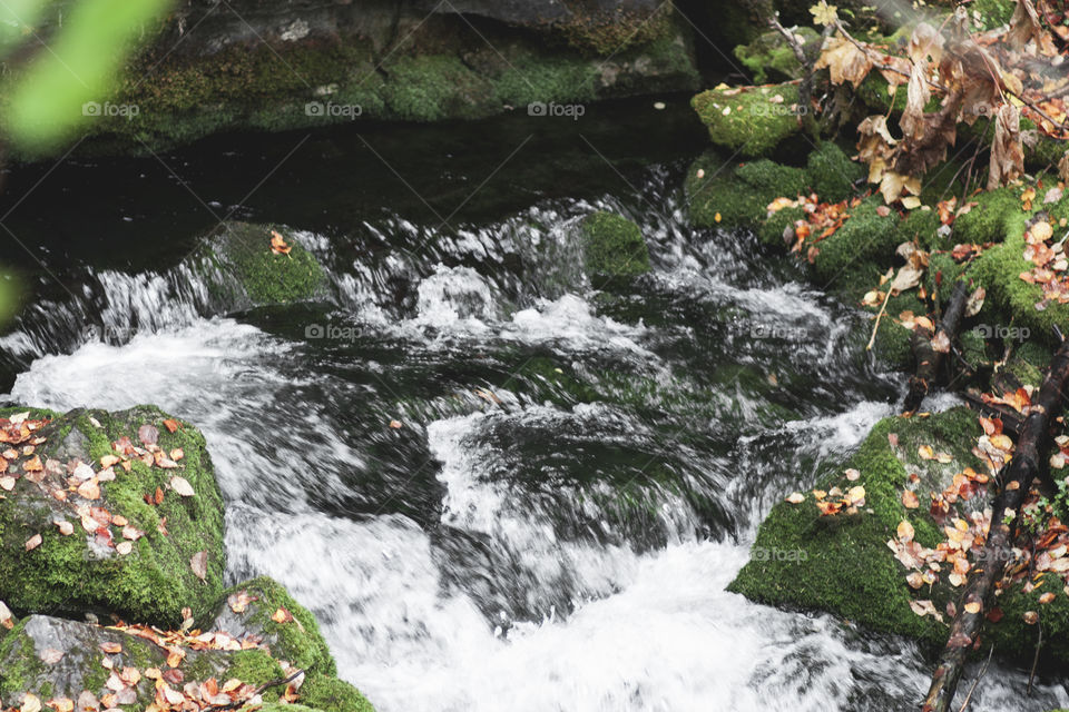 Hole in the wall. Where a mountain fed river flows through a hole in the rocks of the mountain