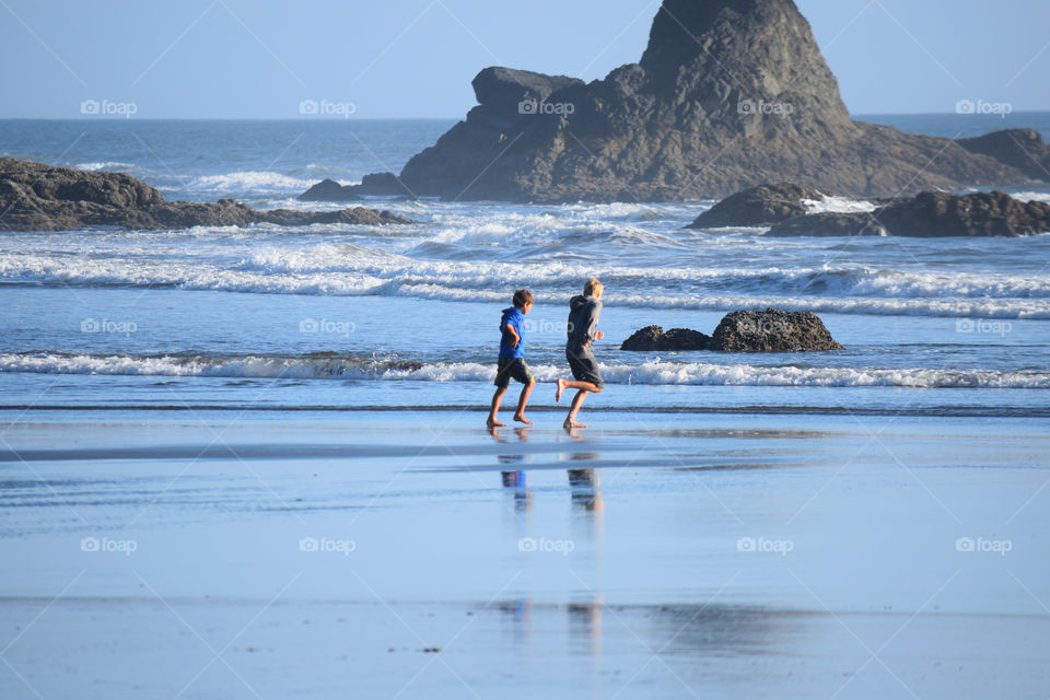 Kids excited running to the beach