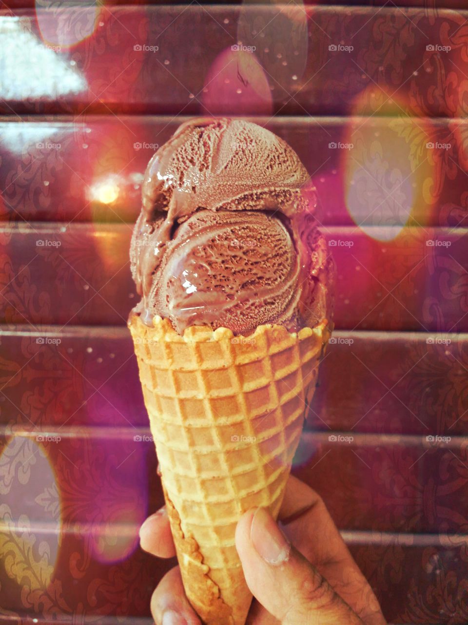 Chocolate Ice Cream Cone.. Chocolate ice cream cone on the red wall. It's delicious at Pai walking street Maehongson Thailand.