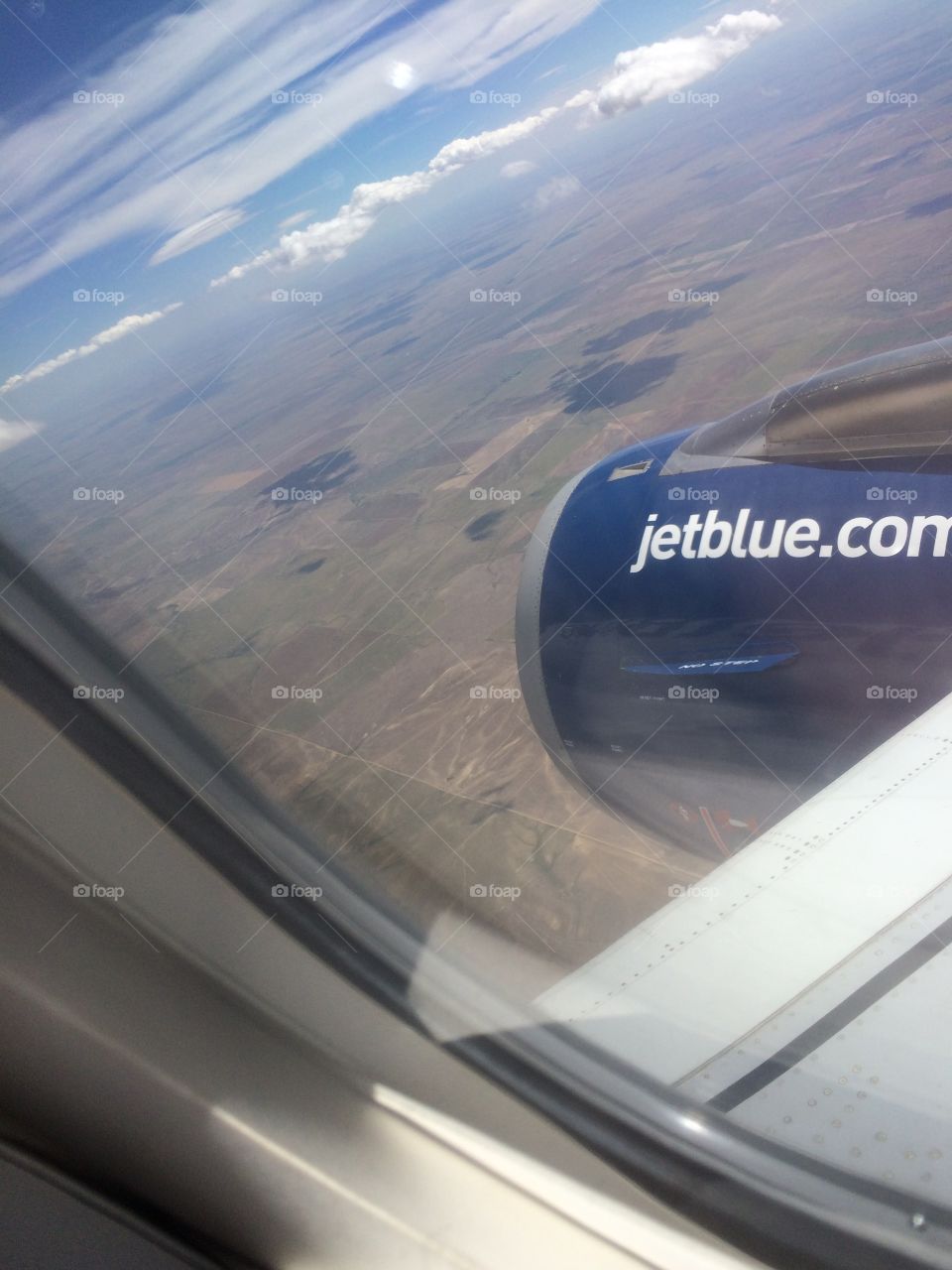 Plane window over the plain 