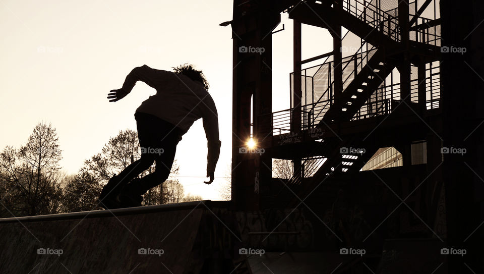 Silhouette of a skater at sunset