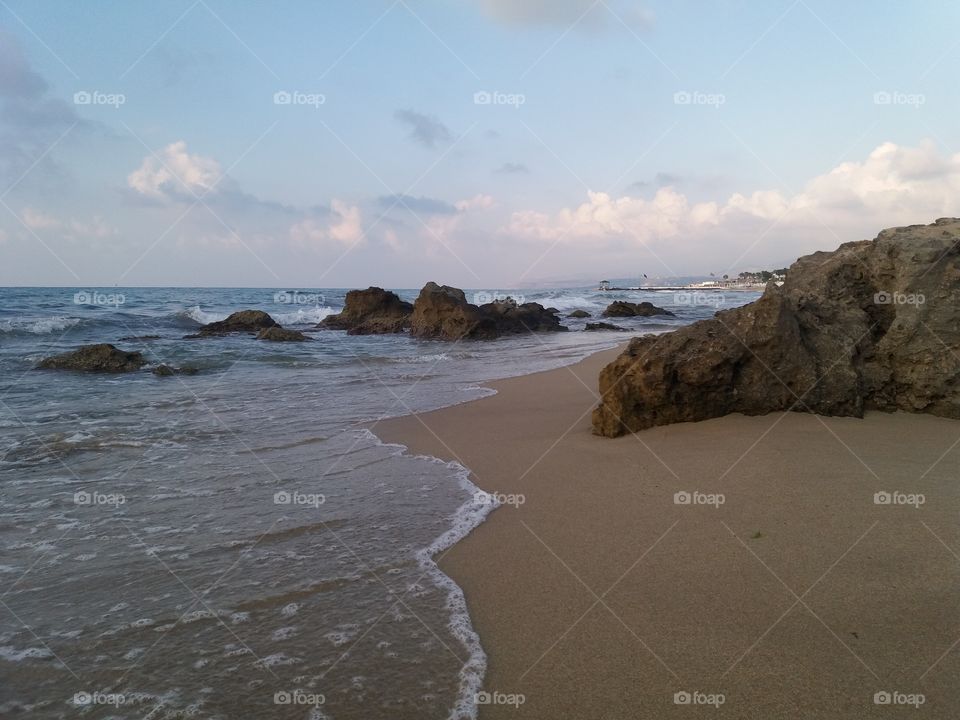 Sand beach with stones