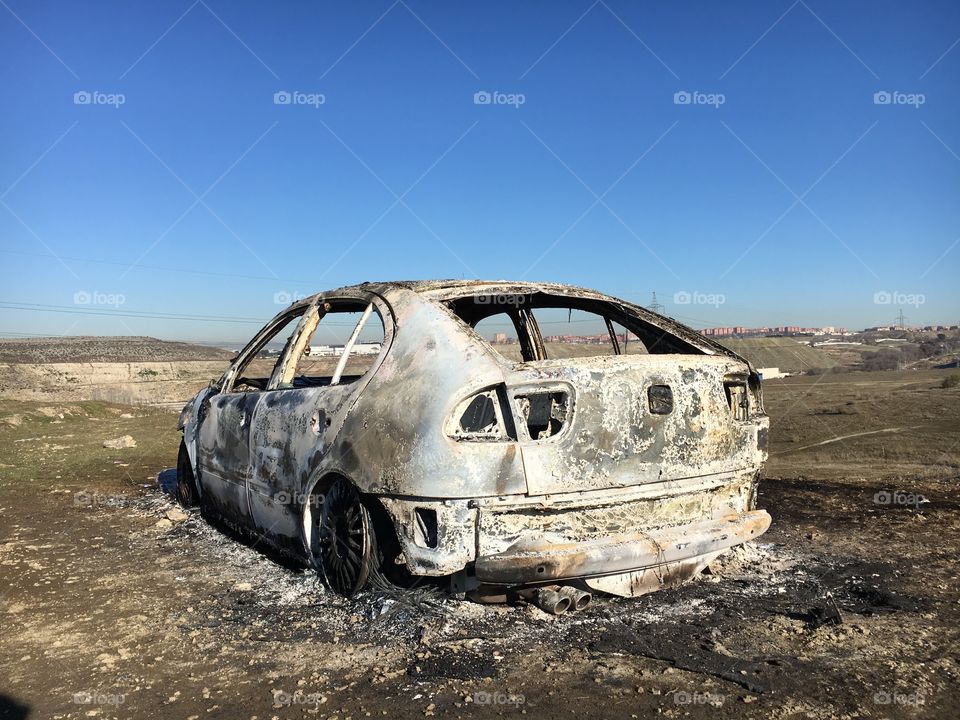 Car burned in the field 