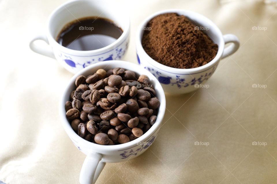 cups of coffee, beans, liquid and powder