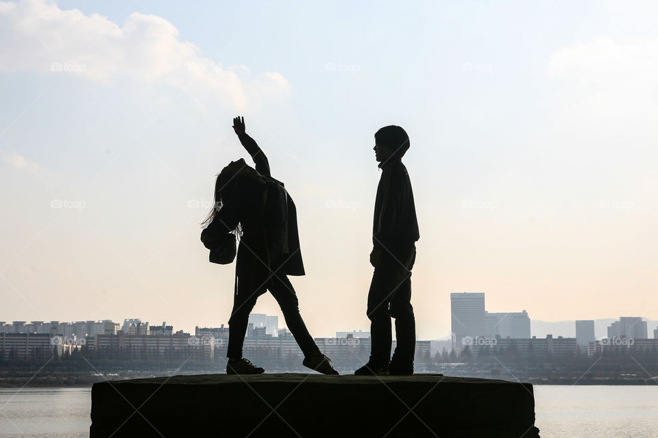 Girl dancing for boy (silhouette), in Seoul