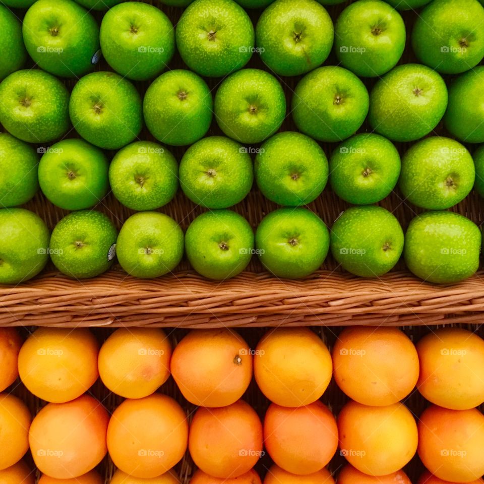 High angle view of orange and green apple