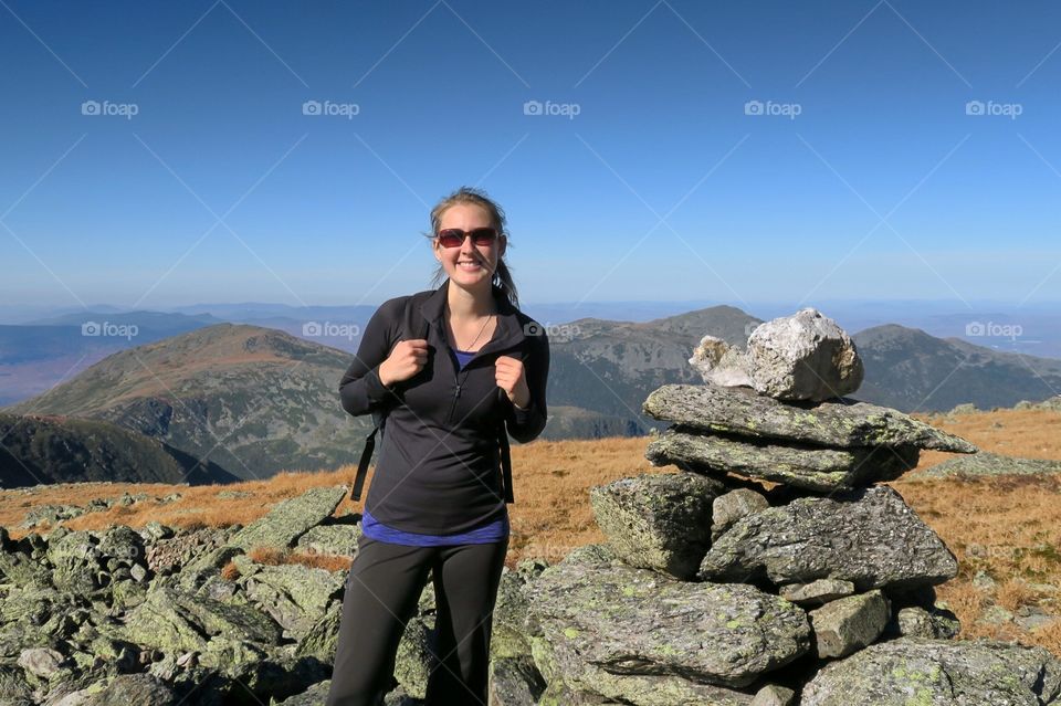 Woman hiking in  mountains  smiling 