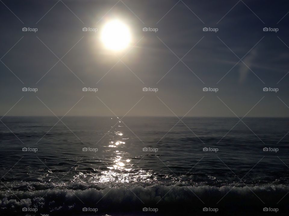 Sparkling silver ocean at sunset.
