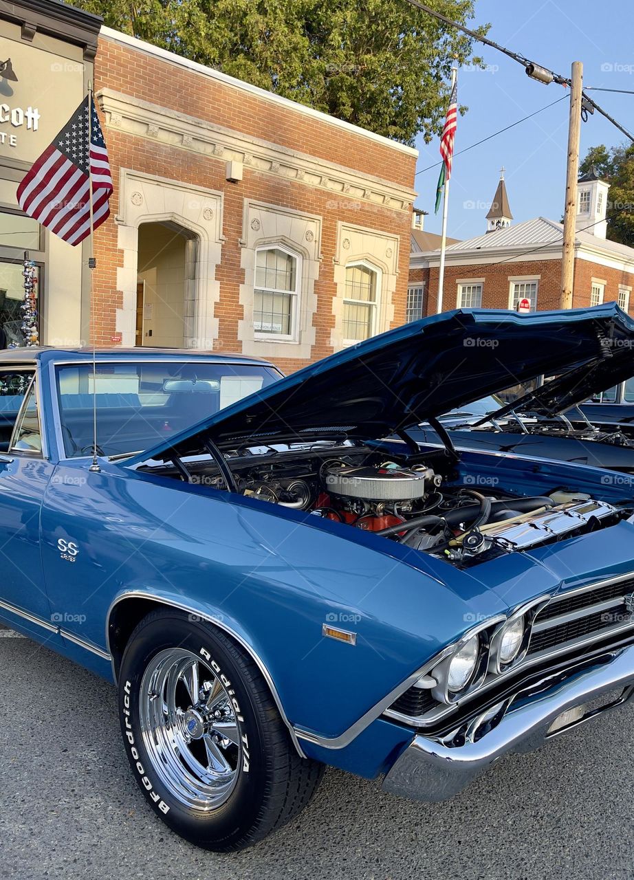 Blue retro car with the open car hood