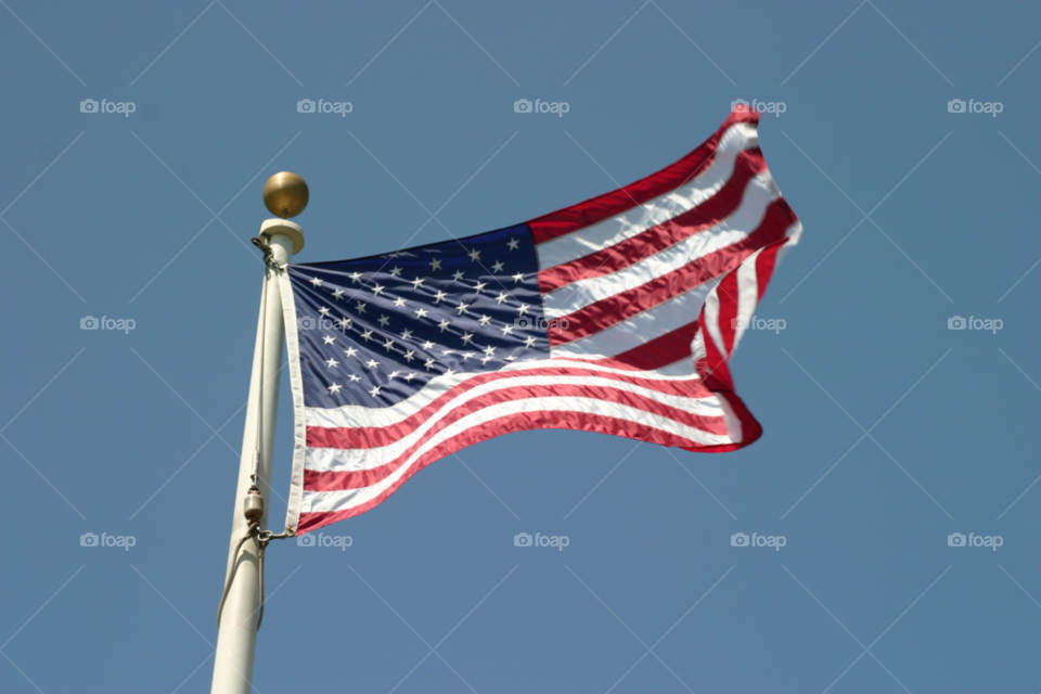 American Flag. American flag with a blue sky in the background 