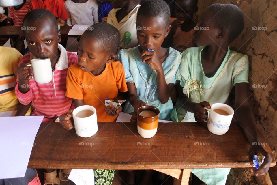 Tea time . Children get a chai tea break.