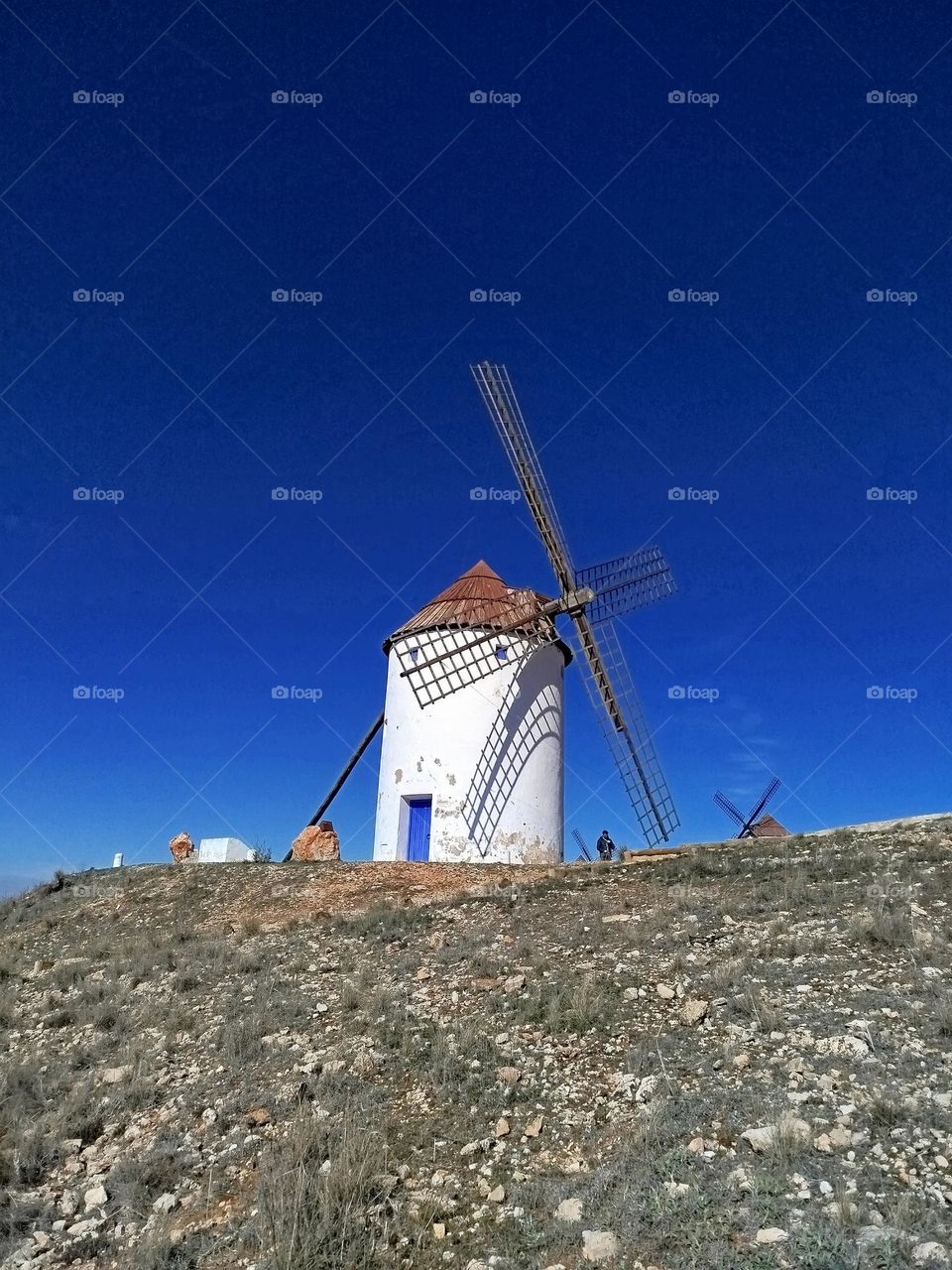 Windmill, Don Quixote de la Mancha, beautiful blue sky matching the mill door.