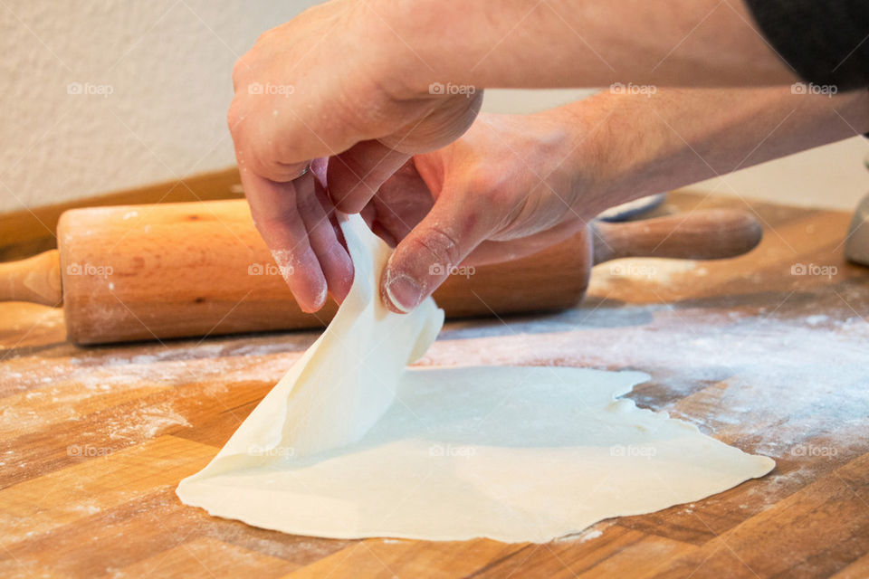 Close-up of hand holding dough